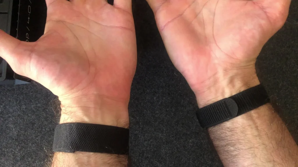 Side-by-side comparison of Hume Band and Whoop showing wrist comfort, strap design, and overall wearability differences.