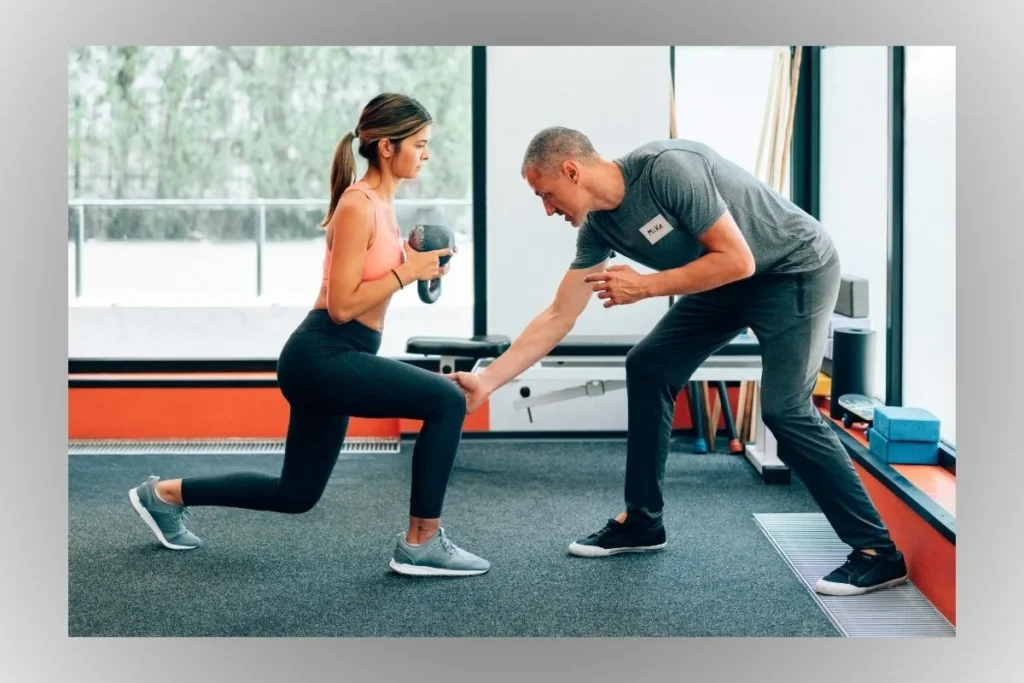 Physiotherapist Ethan Walker assisting a patient during a rehabilitation exercise in a modern clinic, representing practical expertise and real-world health testing.